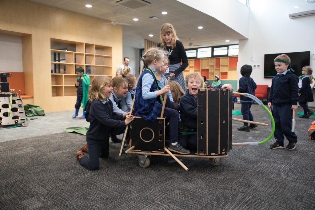 Children engaging in loose parts play with the Nüdel Kart 